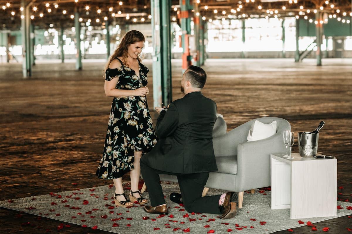 Mike proposing on one knee, August 2019